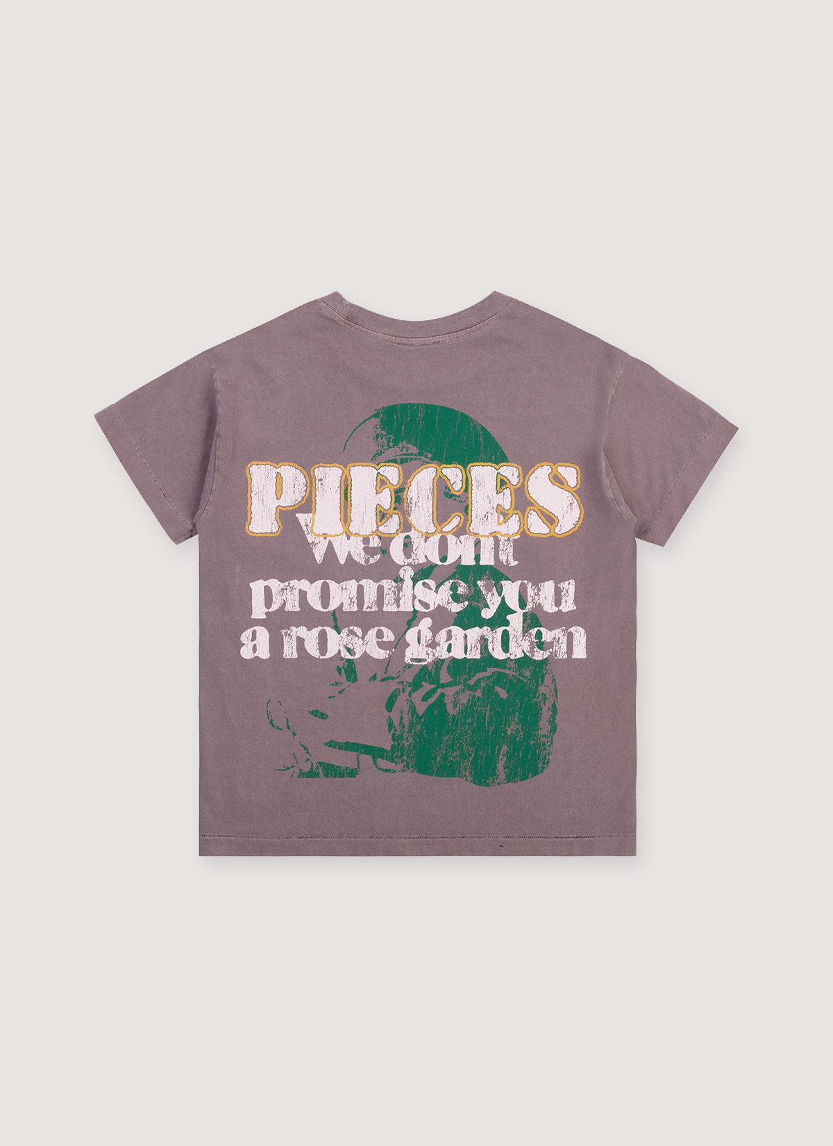 Pieces Rose Garden Tee Shirt Vintage Brown Stone with graphic of green soldier with white text that says We wont promise you a rose garden, back view