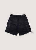 Amiri Satoshi Nakamoto Moto Cotton Denim Shorts Washed Black (Pre-Owned) with 3D moto pads, elasticated waist, raw edge hem, front view Amiri Satoshi Nakamoto Moto Shorts Washed Black (Pre-Owned) - Image 2 | Authenticated at Pieces Los Angeles