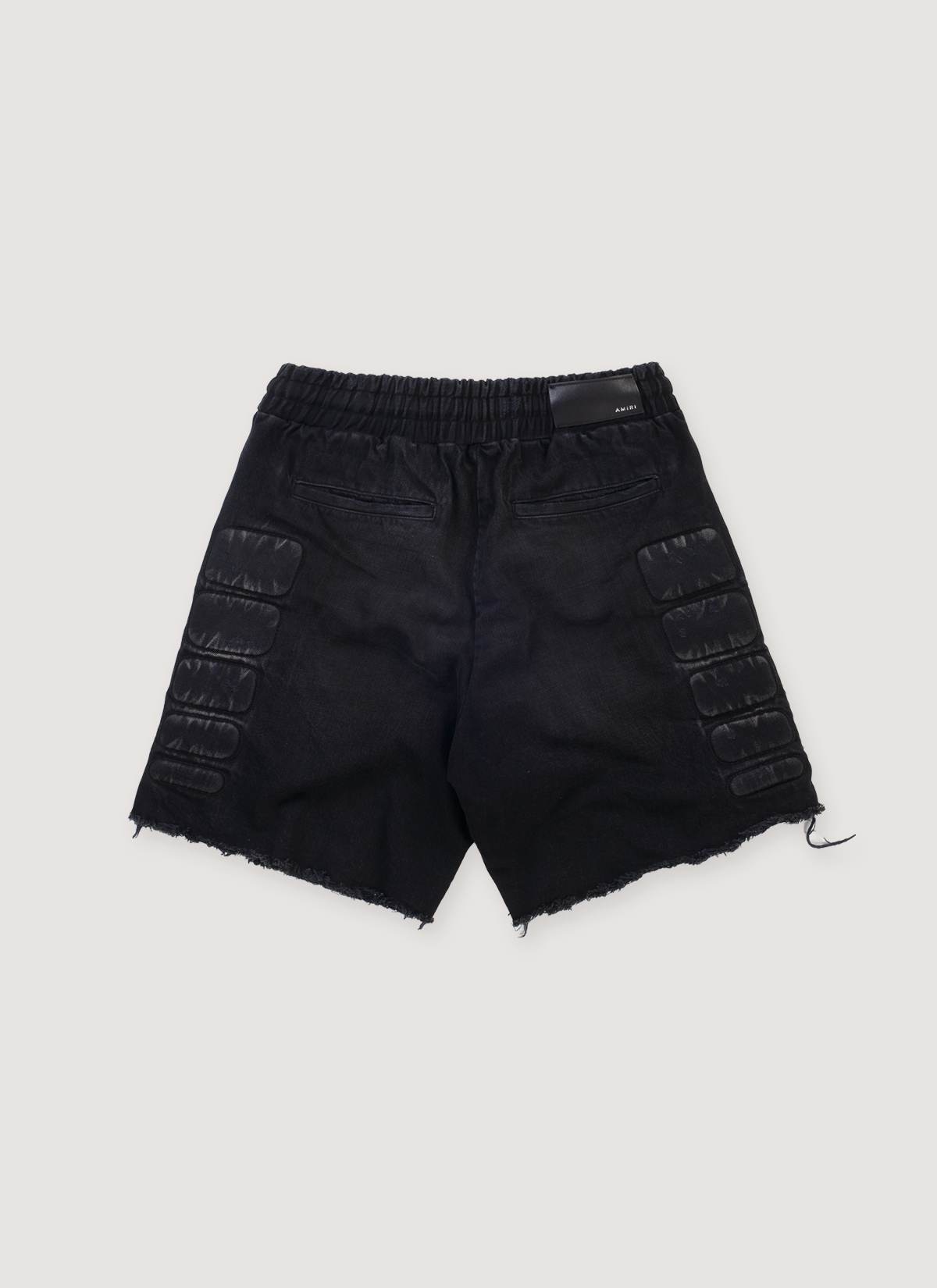 Amiri Satoshi Nakamoto Moto Cotton Denim Shorts Washed Black (Pre-Owned) with 3D moto pads, elasticated waist, raw edge hem, front view