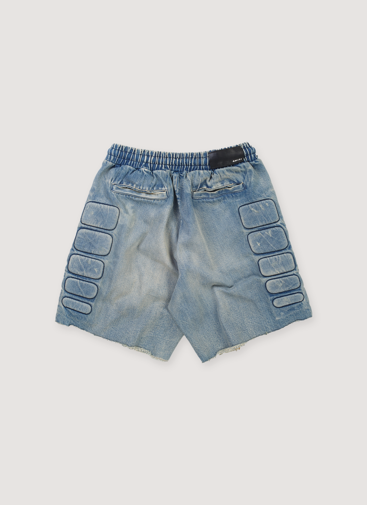 Amiri Satoshi Nakamoto Moto Shorts Indigo Blue Cotton Denim (Pre-Owned) with 3D moto pads, elasticated waist, raw edge hem, back view