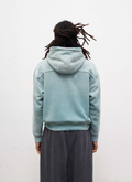 Man wearing sweatpants and the Pieces Basic Program Zip Up Sweatshirt Seafoam Green Blue back view, white background Pieces Basic Program Zip Up Sweatshirt Seafoam - Image 4 | Authenticated at Pieces Los Angeles