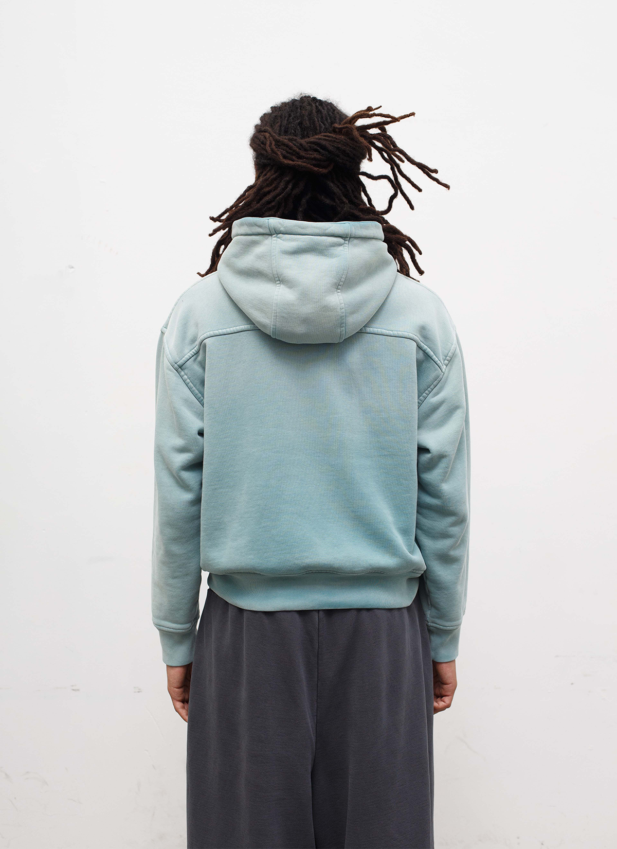 Man wearing sweatpants and the Pieces Basic Program Zip Up Sweatshirt Seafoam Green Blue back view, white background Pieces Basic Program Zip Up Sweatshirt Seafoam - Image 4 | Authenticated at Pieces Los Angeles