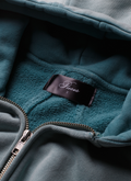 Pieces Basic Program Zip Up Sweatshirt Seafoam Green Blue, close up view of neck tag and zipper Pieces Basic Program Zip Up Sweatshirt Seafoam - Image 5 | Authenticated at Pieces Los Angeles