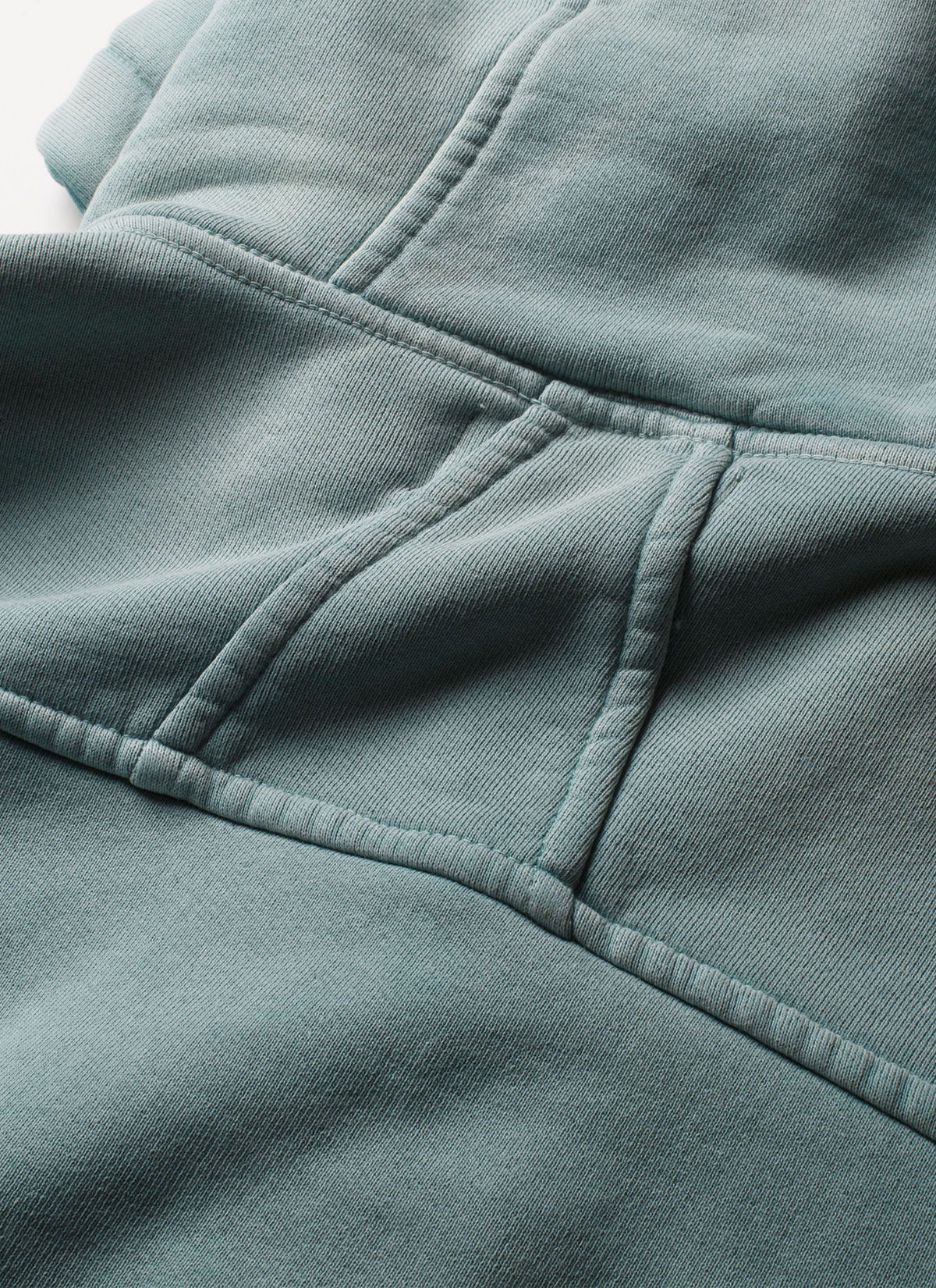 Man wearing sweatpants and the Pieces Basic Program Zip Up Sweatshirt Seafoam Green Blue, close up view of stitching on the back Pieces Basic Program Zip Up Sweatshirt Seafoam - Image 7 | Authenticated at Pieces Los Angeles
