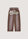 Vale Forever Skittles Sweatpants faded washed Brown with rhinestones white text, front view Vale Forever Skittles Sweatpants Brown - Image 1 | Authenticated at Pieces Los Angeles