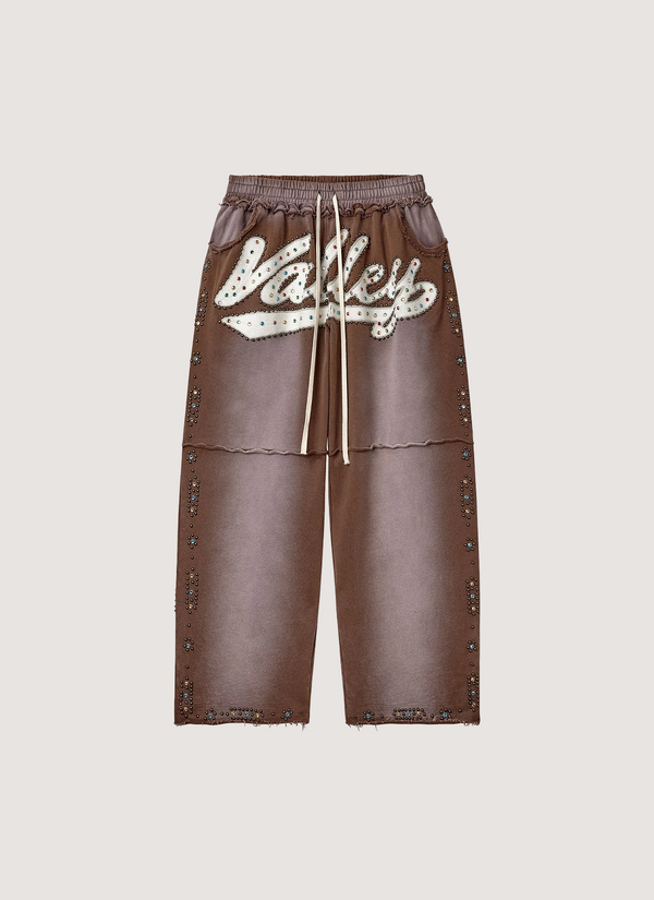 Vale Forever Skittles Sweatpants faded washed Brown with rhinestones white text, front view Skittles Sweatpants Brown - Authenticated Sweatpants | Pieces Los Angeles