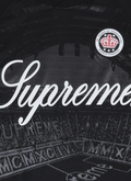 Supreme Jacquard Soccer Jersey tee shirt Black, with woven patch, and embroidered graphic of a stadium that says Supreme, close up view of the stadium and text Supreme Jacquard Soccer Jersey Black - Image 3 | Authenticated at Pieces Los Angeles