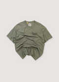 Gallery Dept. Souvenir Tee Shirt Olive Green (Pre-Owned), boxy with black printed logos, front view Gallery Dept. Souvenir Tee Olive (Pre-Owned) - Image 1 | Authenticated at Pieces Los Angeles