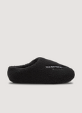 GV Gallery Stacy From The Woods Slips Black slip on slides, plush wool upper, rubber traction sole, embroidered logos, side profile GV Gallery Stacy From The Woods Slips Black - Image 1 | Authenticated at Pieces Los Angeles