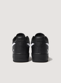 Nike Supreme Air Force 1 Black (2025) with white swoosh, full grain leather upper, perforated leather toe panel, DURAPLUSH lining, co-branded footbed, debossed printed logo, Supreme branded laces, back view of both shoes Supreme Air Force 1 Black (2025) - Image 2 | Authenticated at Pieces Los Angeles