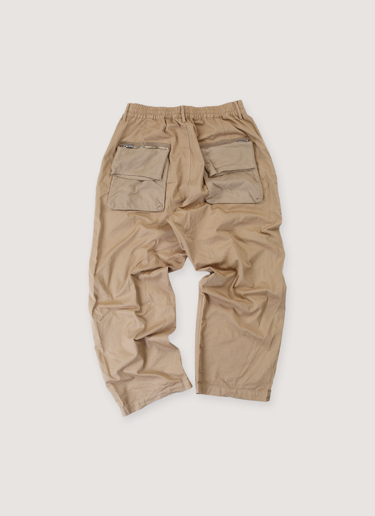 Undercoverism Wide Leg Pleated Trouser Beige Pants (Pre-Owned) with elasticated waist, back pouck pocket with zipper, wide leg fit, back view