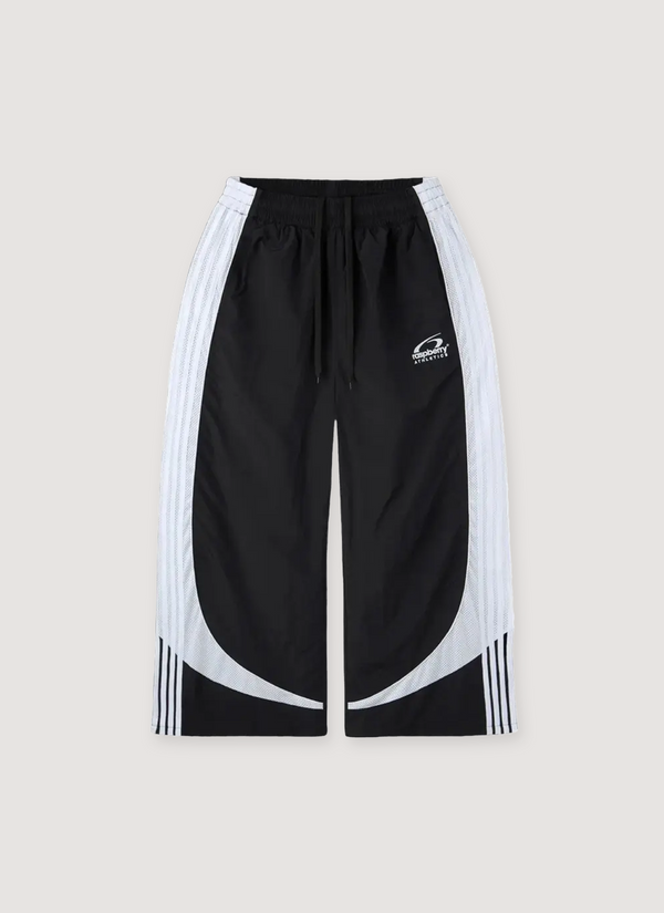 GV Gallery Tuxedo Sweatpants Black and white with nylon outer with mesh inner lining, embroidered Raspberry logo, contrast mesh paneling, side striping, side seam pockets, elasticated waist with drawcord, baggy, wide leg fit, front view Tuxedo Sweatpants Black - Authenticated Trackpants | Pieces Los Angeles