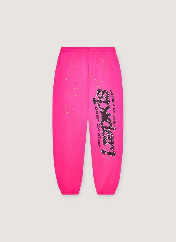 Sp5der Worldwide Punk V2 Sweatpants Magenta Pink with black text and little yellow stars, front view Punk V2 Sweatpants Magenta - Authenticated  | Pieces Los Angeles